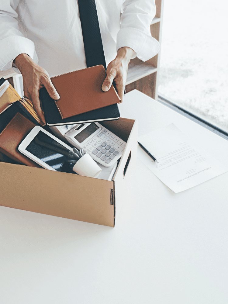 Unfair Dismissal RLL Legal a box with desk items in being packed up